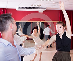 Dancing couples enjoying latin dances