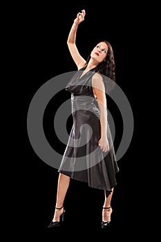 Dancing female on the black background