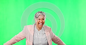 Dancing, green screen and senior woman blowing a kiss for happiness and doing happy dance in a studio background