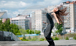 Dancing hip-hop over urban city