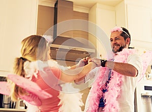 Dancing with his little darling. a father and his little daughter having fun at home.