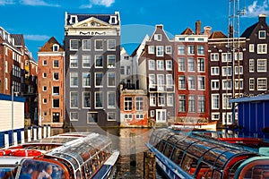 The dancing houses at Amsterdam canal Damrak, Holland, Netherlands.