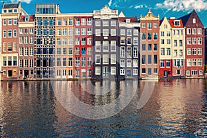 The dancing houses at Amsterdam canal Damrak, Holland, Netherlands.