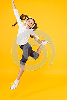 Dancing lesson. Child enjoy music sound. Audio schooling. Home schooling. Small girl pupil headphones. Child happy