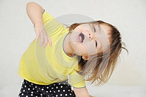 Dancing little girl having fun isolated, happy childhood concept, positive expressing emotion