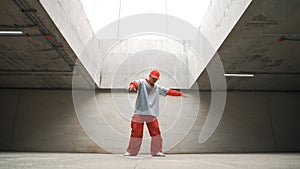 Dancing man enjoy practice break dance or freestyle in building. Sprightly.