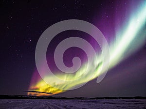 Dancing Northern Lights and Stars over Frozen Lake