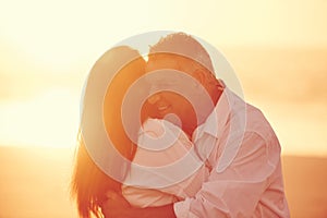 Dancing in paradise. an affectionate mature couple embracing on the beach at sunset.