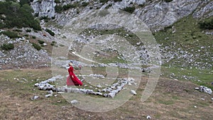 dancing in red in mountains