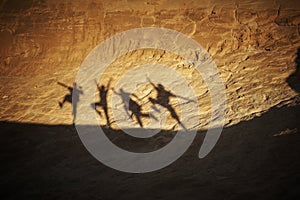 Dancing shadows on the rock in the desert