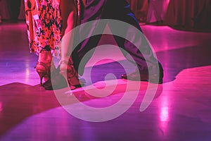 Dancing shoes of a couple, couples dancing traditional latin argentinian dance milonga in the ballroom, tango salsa bachata