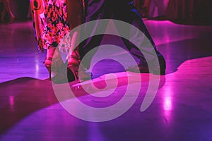 Dancing shoes of a couple, couples dancing traditional latin argentinian dance milonga in the ballroom, tango salsa bachata