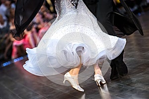 Dancing shoes feet and legs of female and male couple ballroom