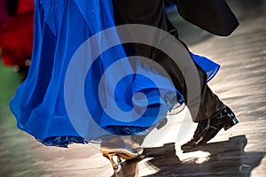 Dancing shoes feet and legs of female and male couple ballroom