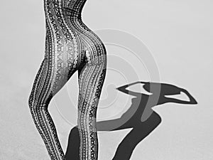 Dancing slender woman in overall a fine ornament photo
