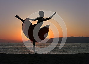 Dancing woman on the beach