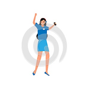 Dancing young girl in blue skirt with on ear headphones photo