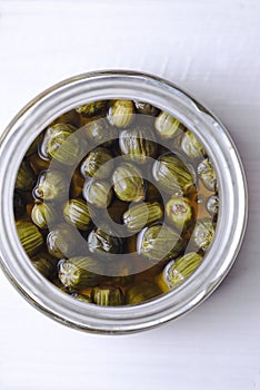 Dandelion capers in glass jar