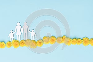 Dandelion flowers and family shape on blue background top view