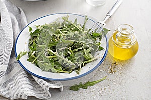 Dandelion salad with dressing