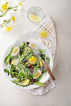 Dandelion salad with eggs, potato and beans