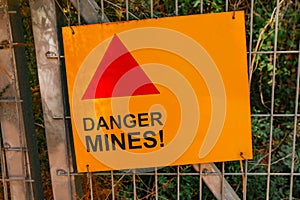 Dander mines sign. Minefield sign in English.