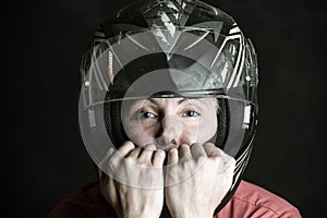 Danger and adrenaline are my name - portrait of a woman in a motorcycle helmet