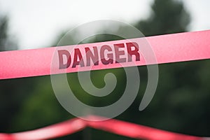 Danger Boundary Tape in a Field.