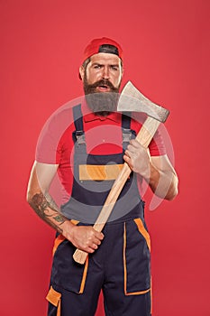 Danger concept. Renovation concept. Bearded handyman. Brave worker. Cutting beard. Brutality and masculinity. Bearded