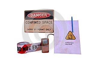 Danger confined space entry by permit only warning sign, barricade danger tape with white background photo