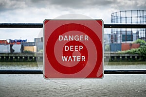 Danger deep water sign on canal. London, Docklands