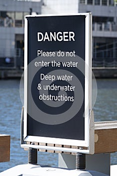 DANGER deep water sign at Canary Wharf, London.