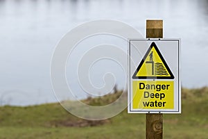 Danger Deep Water sign on a wooden post