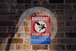Danger, do not enter sign and symbol on brick wall