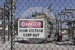 Danger - High Voltage Keep Out sign in front of an electric company substation