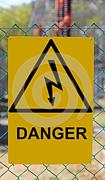 Danger high voltage risk of death sign  with lightning bolt in triangle photo