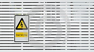 Danger high voltage sign and background photo