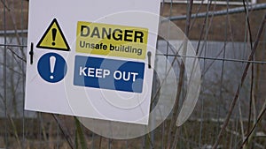 Danger keep out sign on building after fire