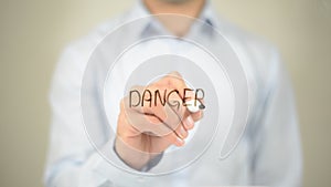 Danger, Man writing on transparent screen