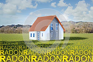 The danger of natural radon gas in our homes - concept with home model and radon gas rising