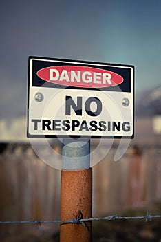 Danger No Trespassing Sign with Barbed Wire Near a Volcano in Iceland