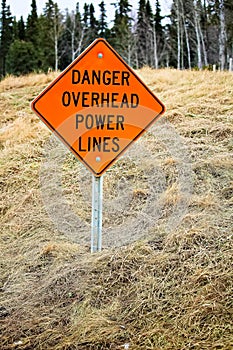 Danger overhead powerline sign in the country