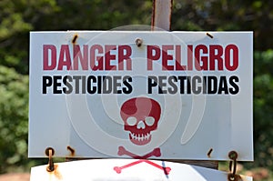 Danger Pesticides Peligro sign photo