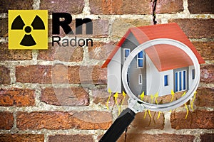 The danger of radon gas in buildings - concept with periodic table of the elements, radioactive warning symbol and home icon seen