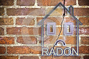 The danger of radon gas in our homes - concept image with an outline of a small house with radon text against a cracked brick wall