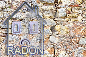 The danger of radon gas in our homes - concept image with an outline of a small house with radon text against an old cracked stone