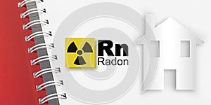 The danger of radon gas in our homes - concept with periodic table of the elements, radioactive warning symbol and home silhouette