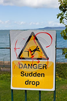 Danger road sign on a fence