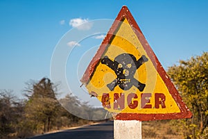 Danger road sign with skull and crossbones