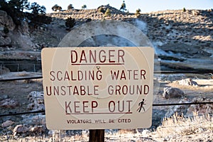 Danger -- Scalding Water -- Keep Out Steam Rising in Background photo